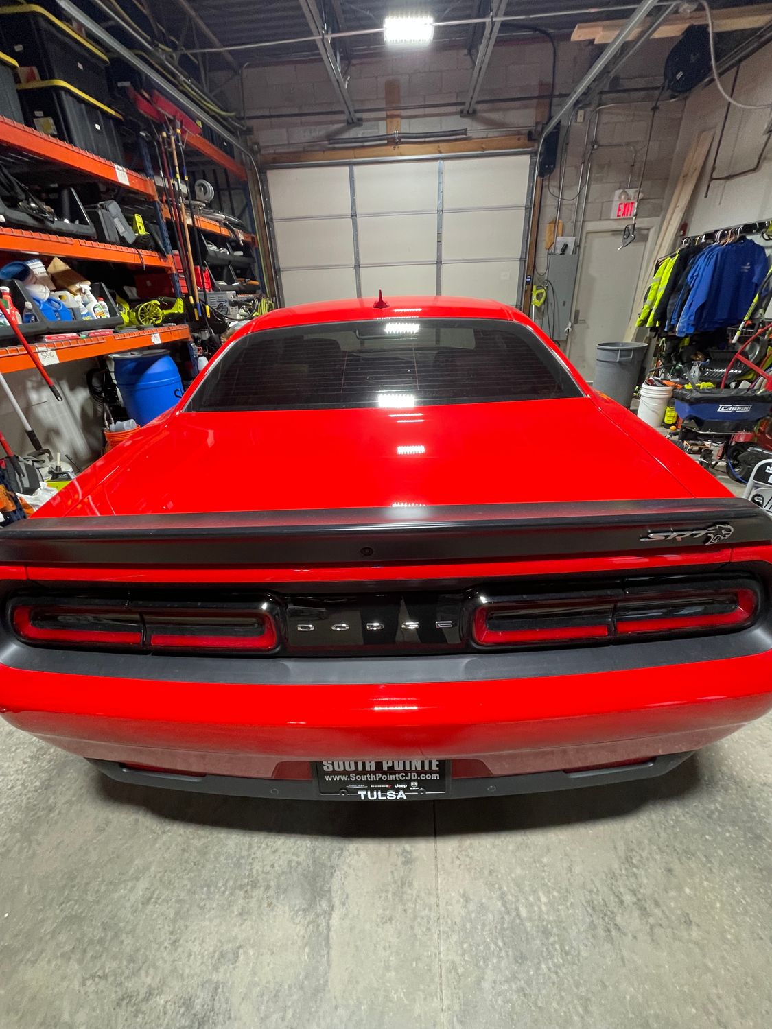 Red Dodge Challenger rear view after detail